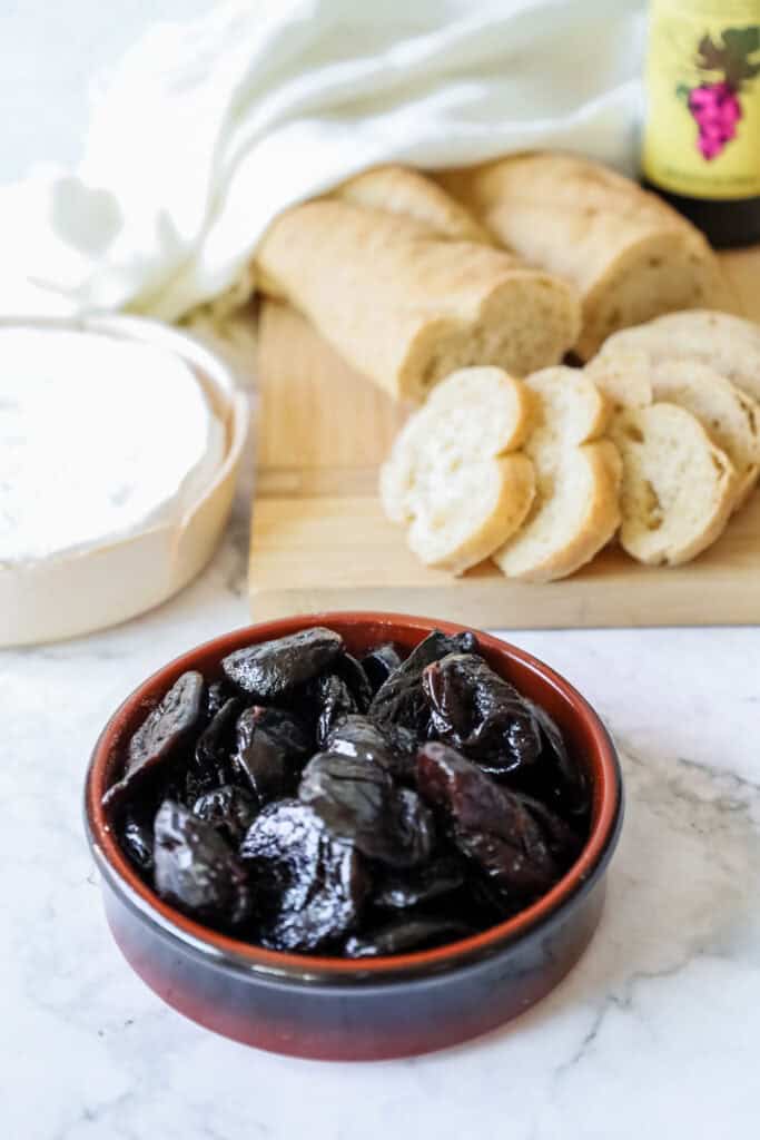 ingredients for crostini topped with prunes and brie