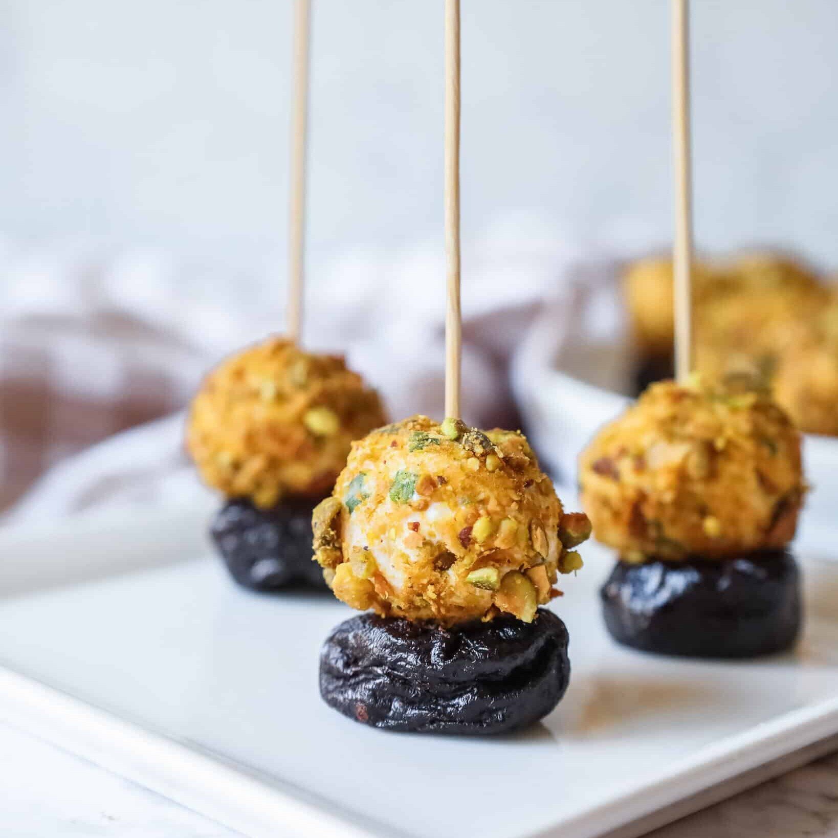 cheeseball stuffed prunes with toothpicks