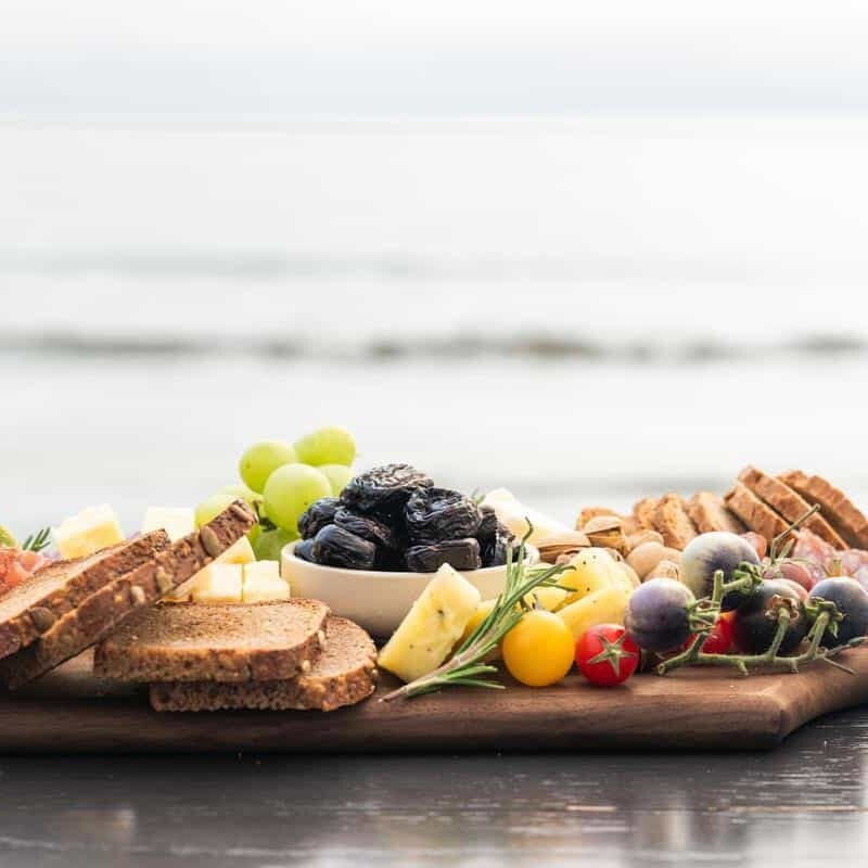 cheese board | charcuterie featuring California Prunes at the beach in California
