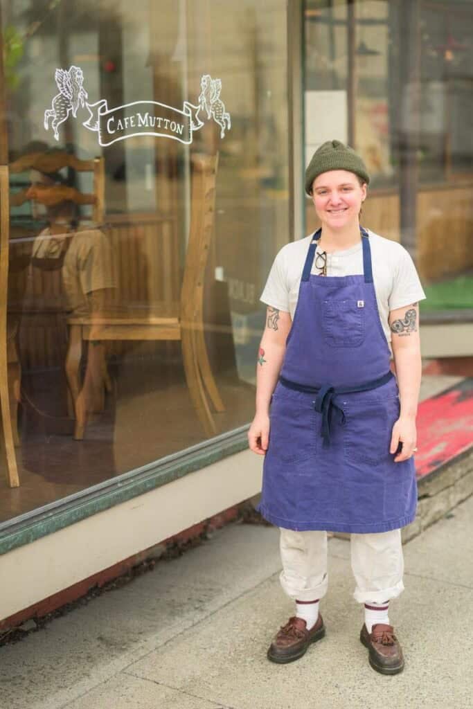 Shania Loew-banayan standing in front of their restaurant, Cafe Mutton