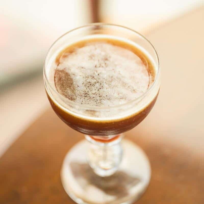 poo driver cocktail in a nick and nora glass