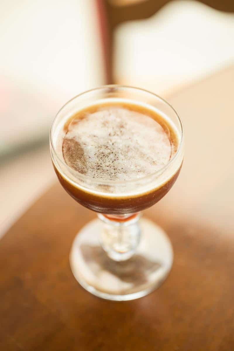 poo driver cocktail in a nick and nora glass