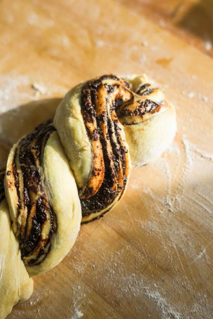 beautifully twisted babka on a wooden board