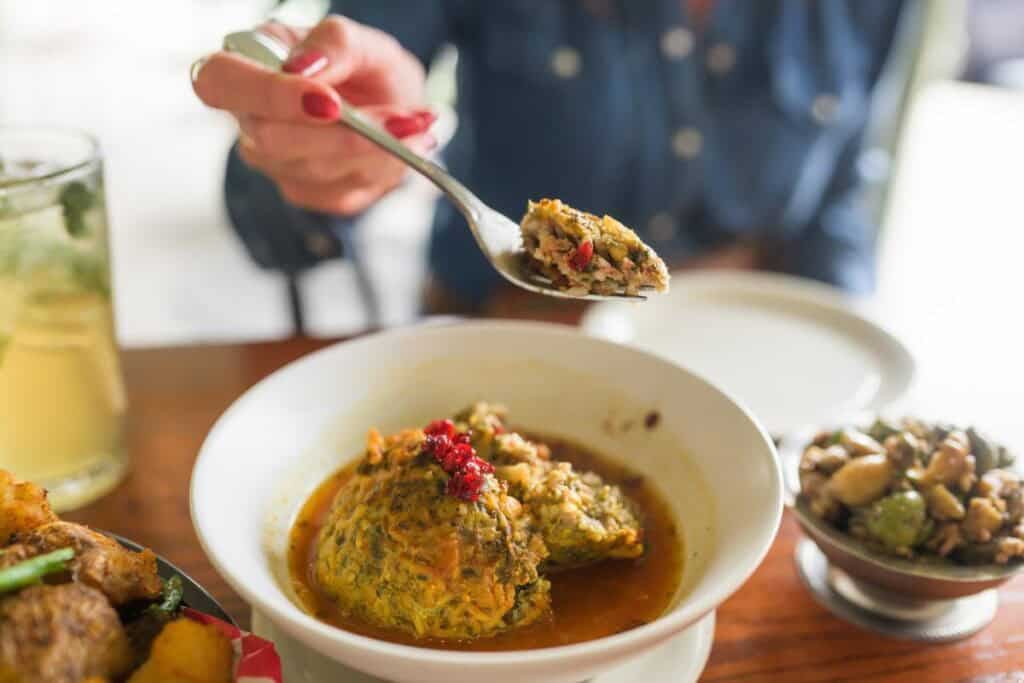 woman with a forkfull of meatball