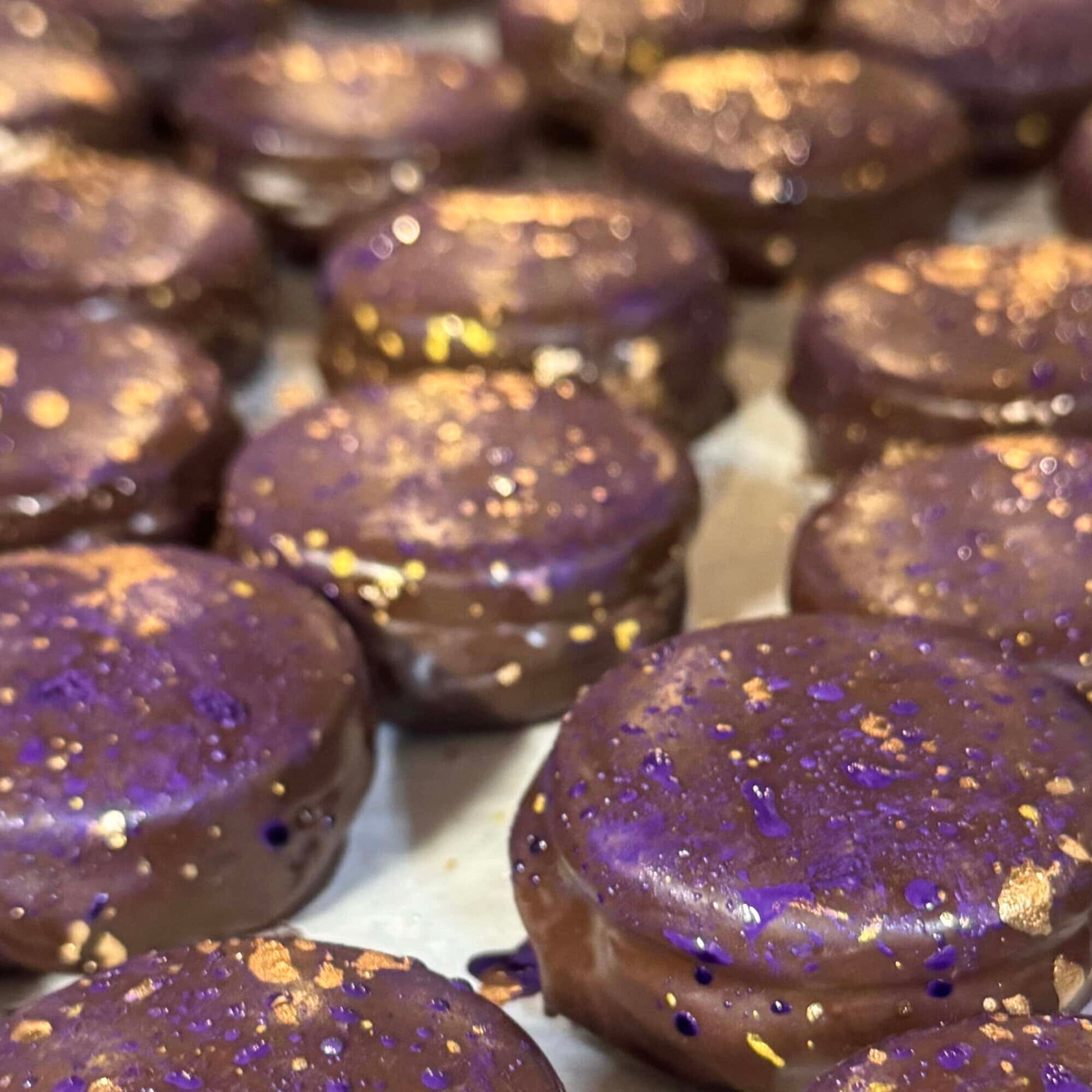 chocolate glazed sandwich cookies on a tray