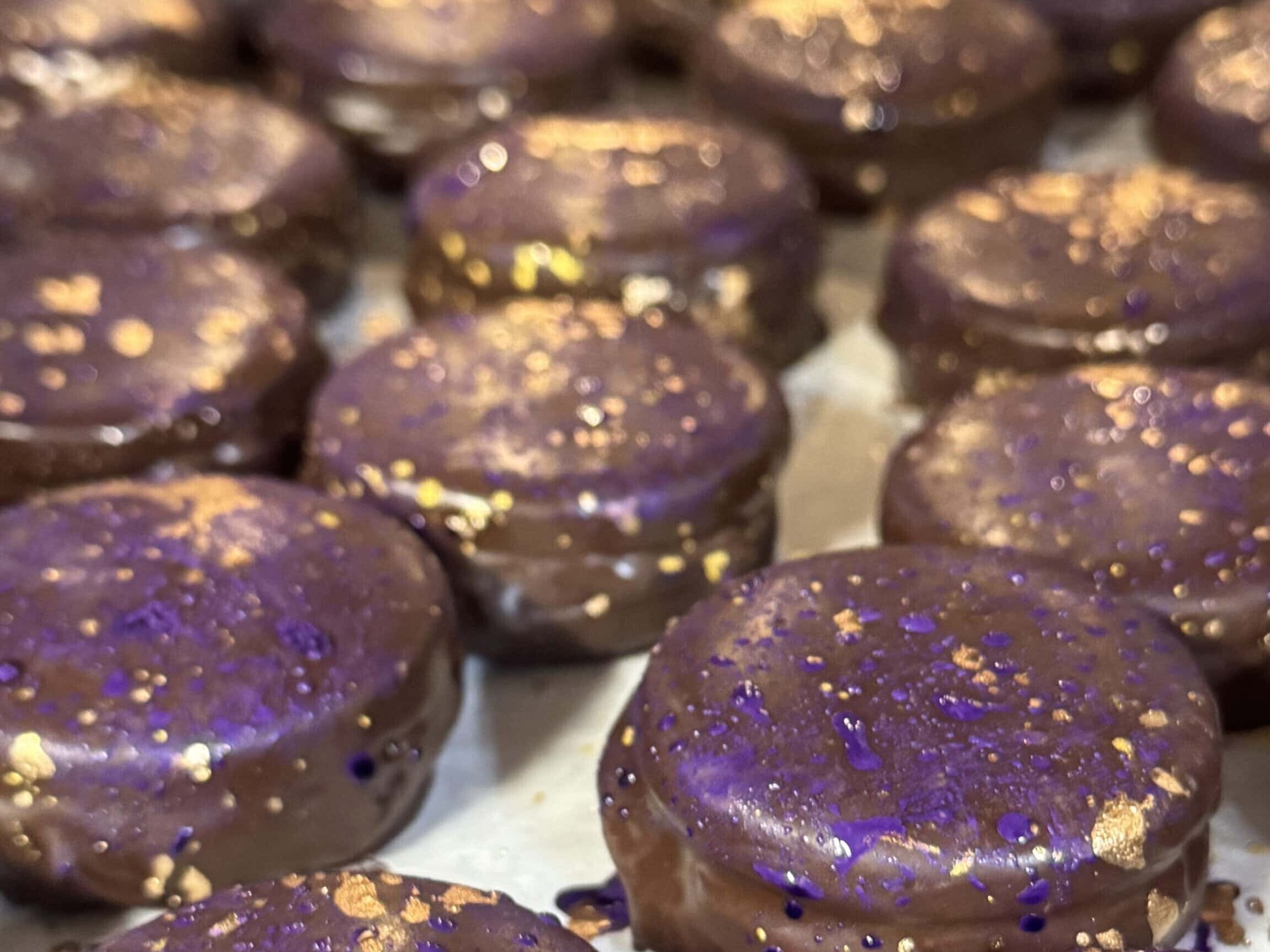 chocolate glazed sandwich cookies on a tray