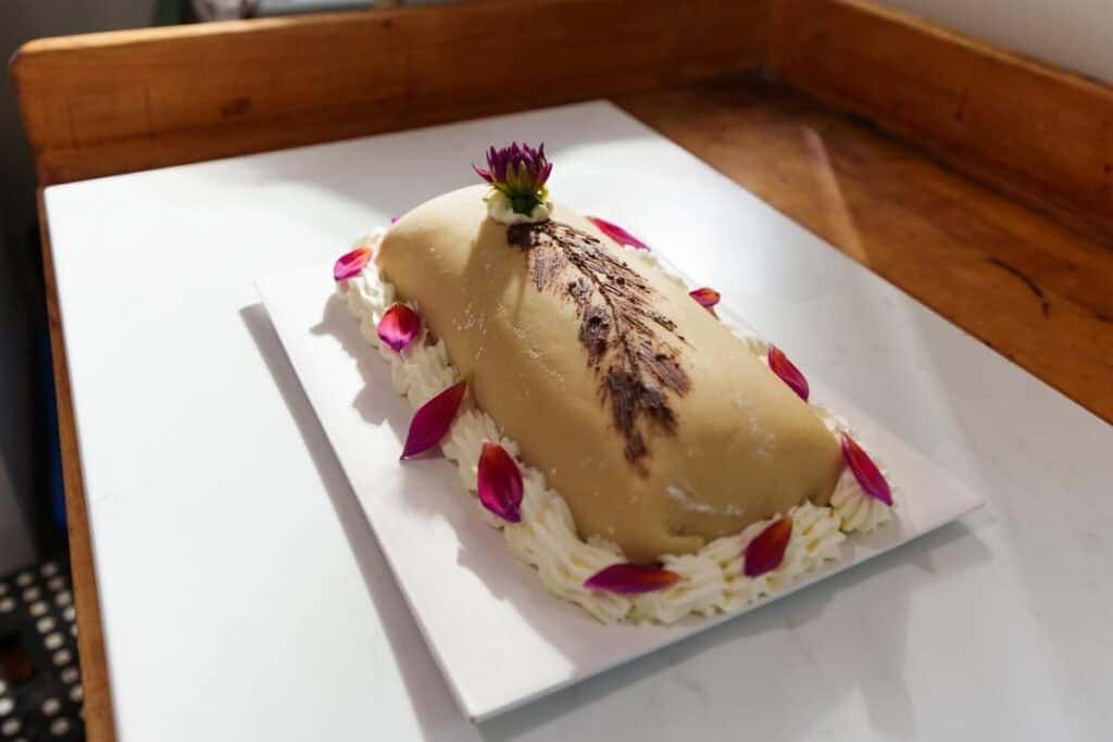 Goose breast cake on a white platter