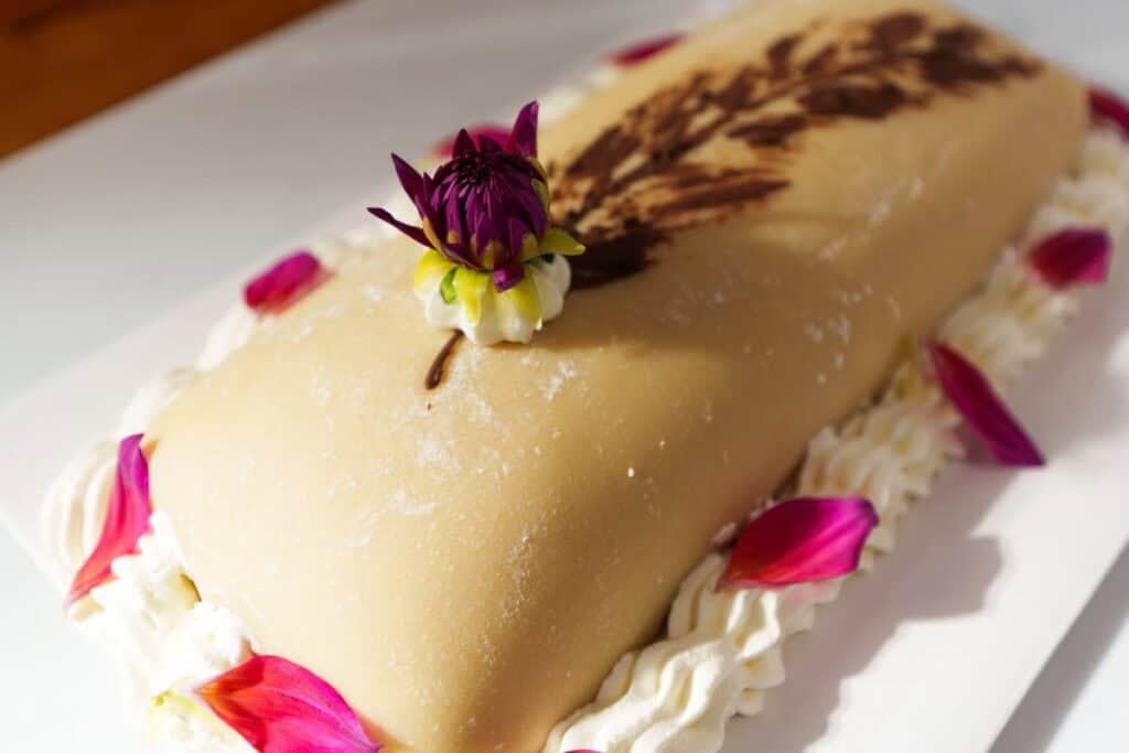 Goose breast cake on a white platter
