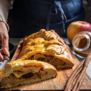 prune apple strudel on a wooden board