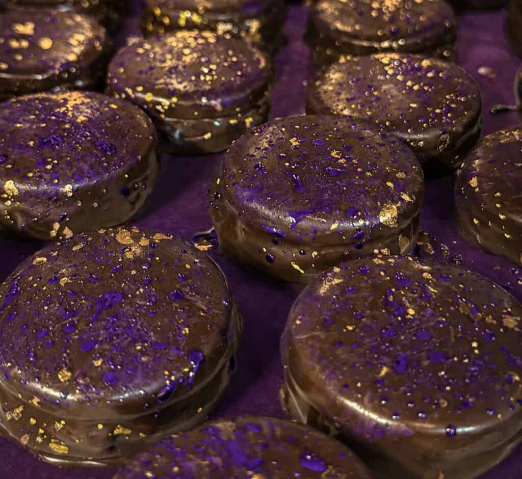 chocolate glazed sandwich cookies on a tray