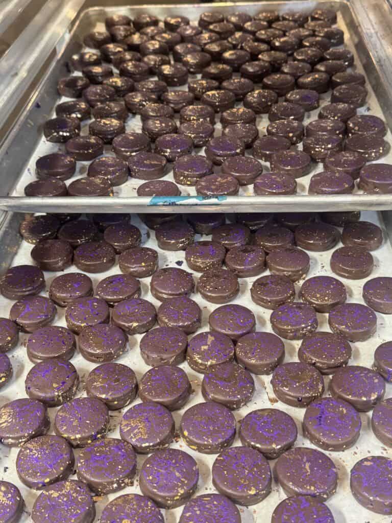 chocolate glazed sandwich cookies on a tray