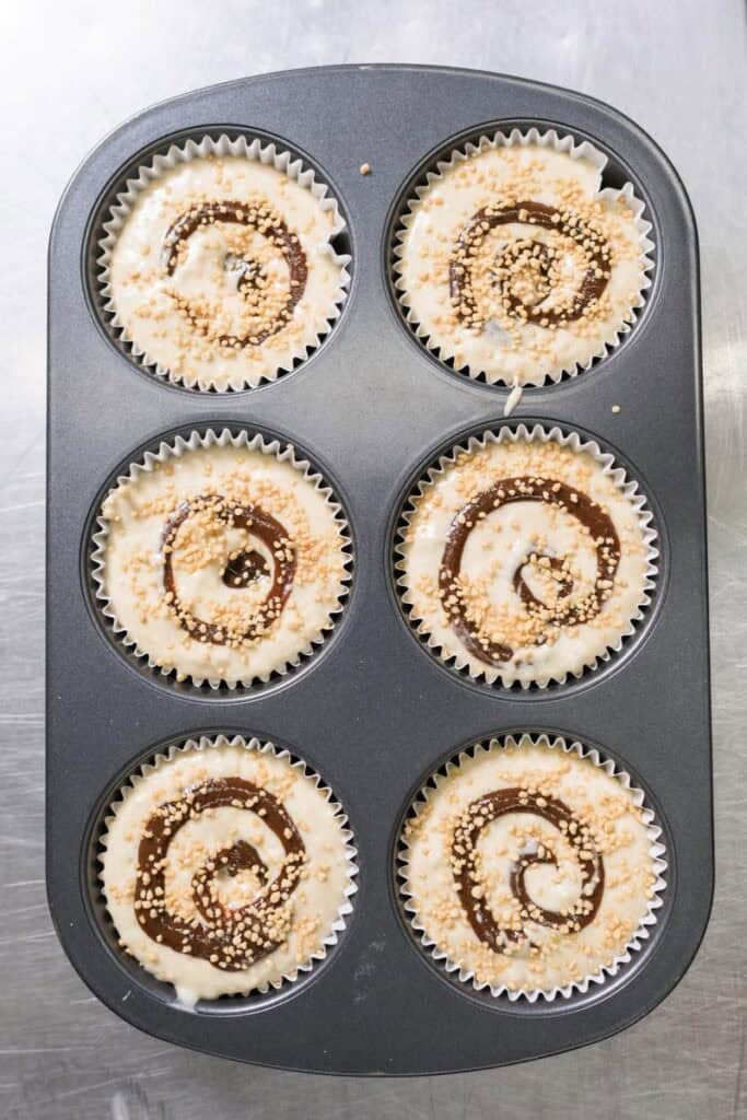 swirls of prune butter in muffin batter