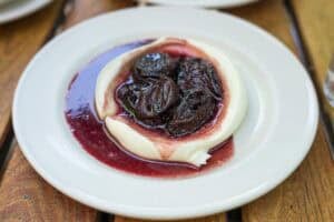 red wine prunes on top of mascarpone cream at frankies spuntino
