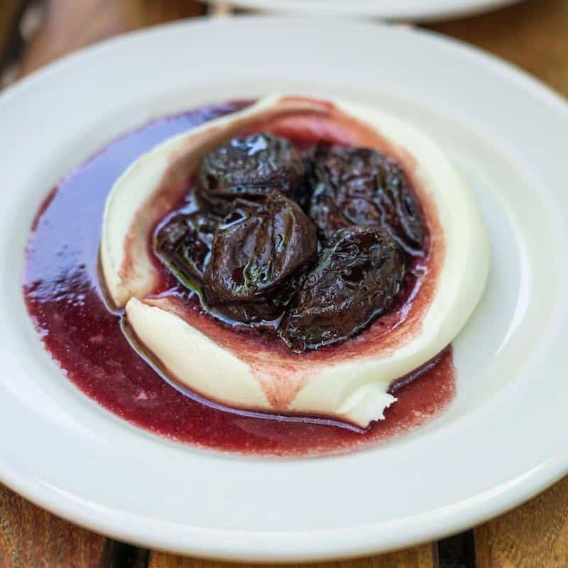 red wine prunes on top of mascarpone cream at frankies spuntino