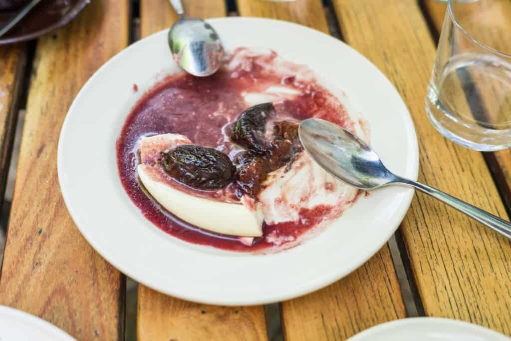 red wine sauce on a plate after all the dessert has been eaten