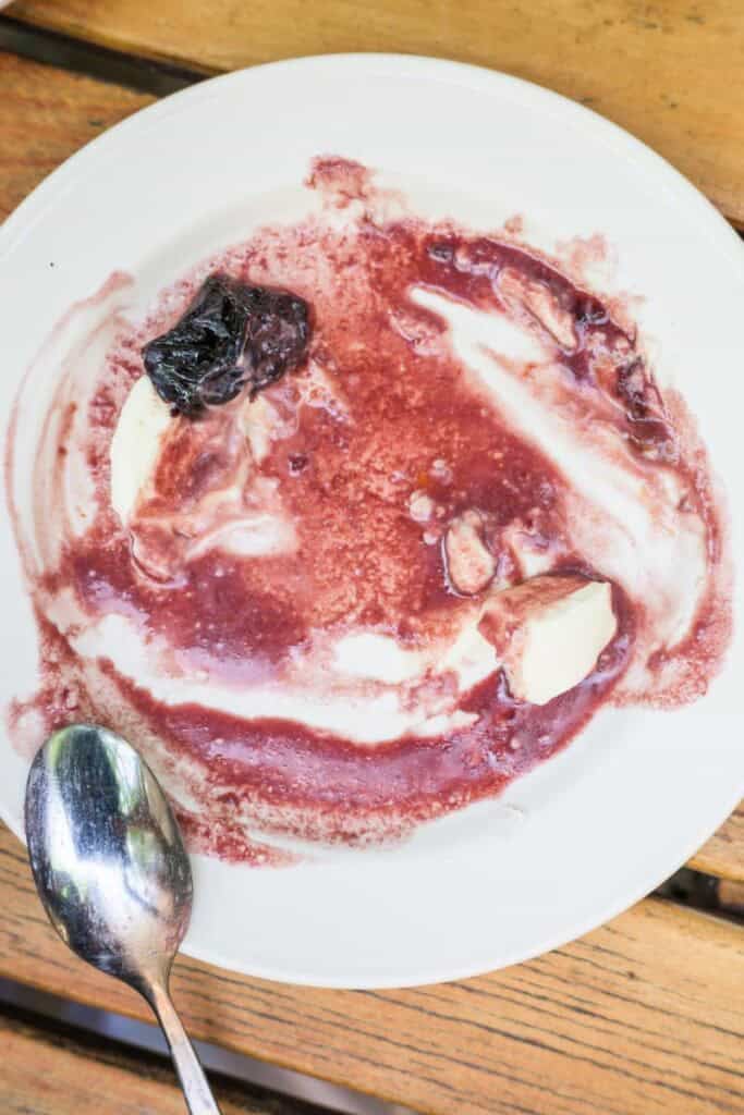 red wine sauce on a plate after all the dessert has been eaten