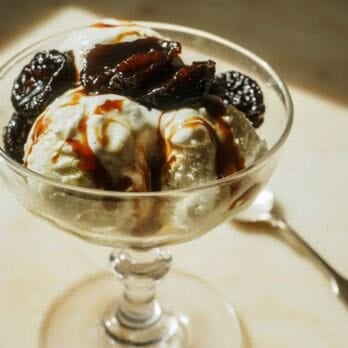 prunes caramelized in olive oil on top of vanilla ice cream