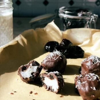 coconut bonbons on a parchment lined baking sheet