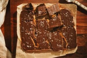 dulce de leche chocolate bars sliced on parchment paper