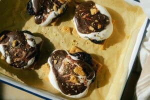 prune s'mores on a sheet pan covered with parchment paper