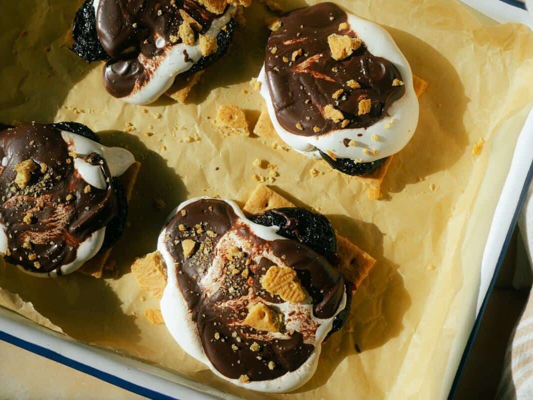 prune s'mores on a sheet pan covered with parchment paper