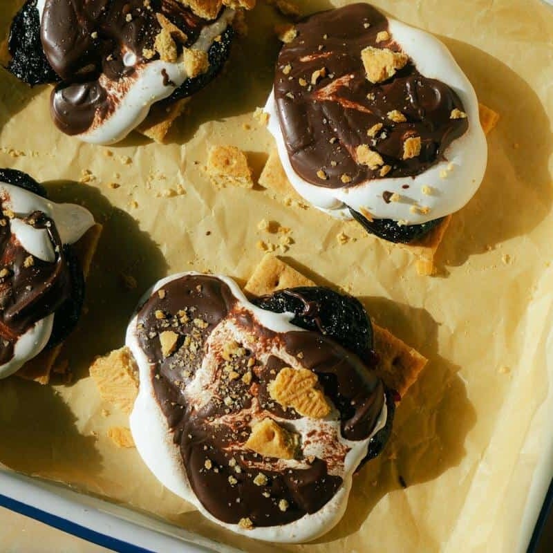 prune s'mores on a sheet pan covered with parchment paper