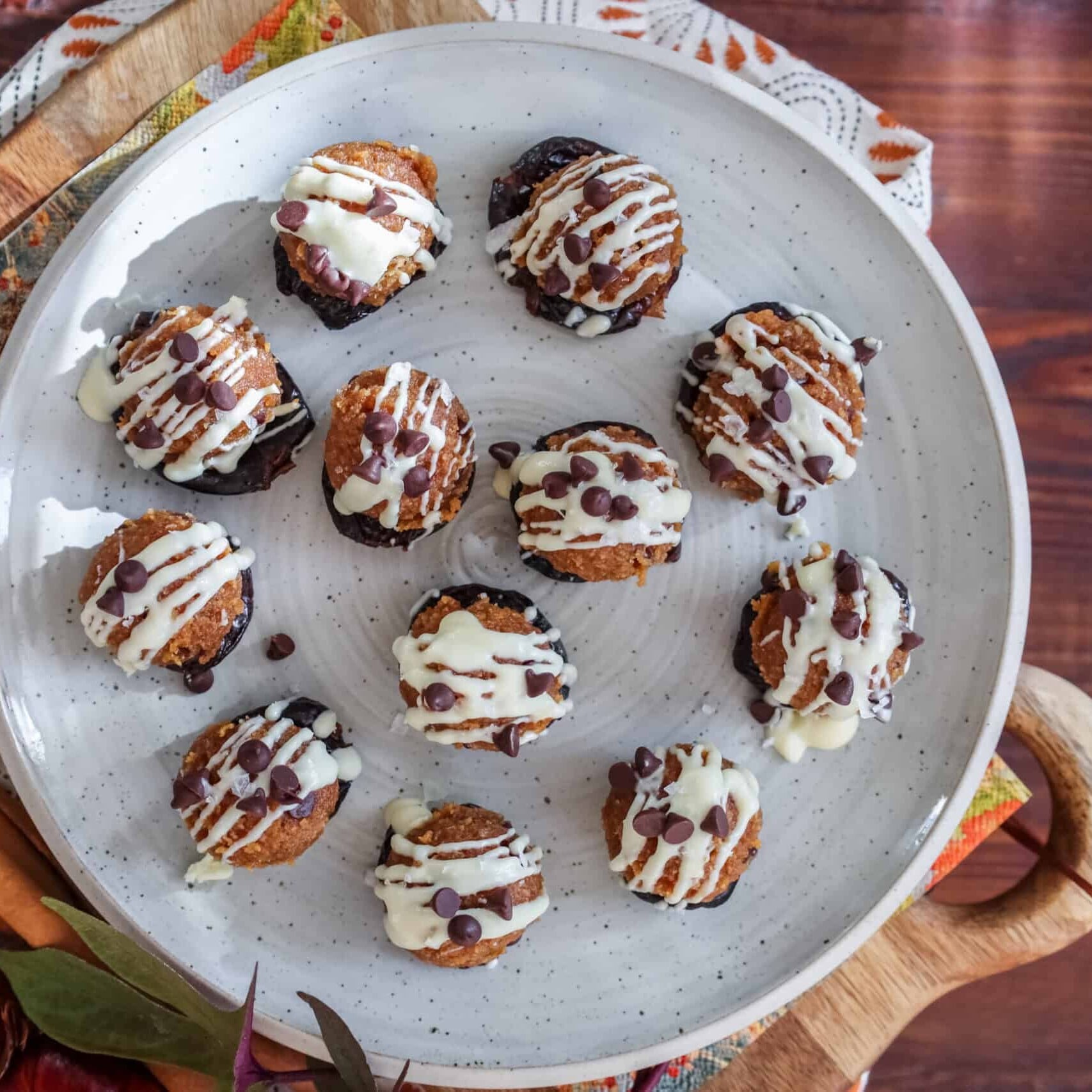 pumpkin spice cookie dough bites arranged on a white plate