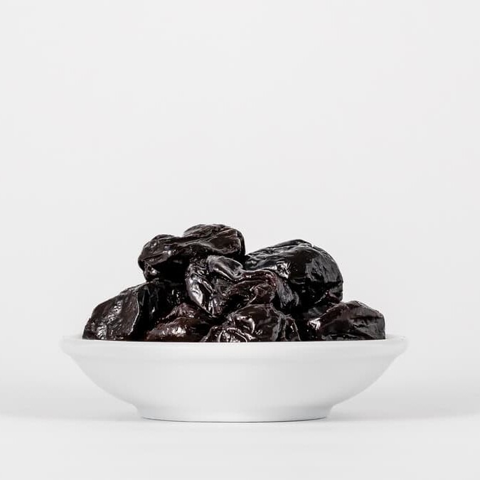 prunes in a white bowl