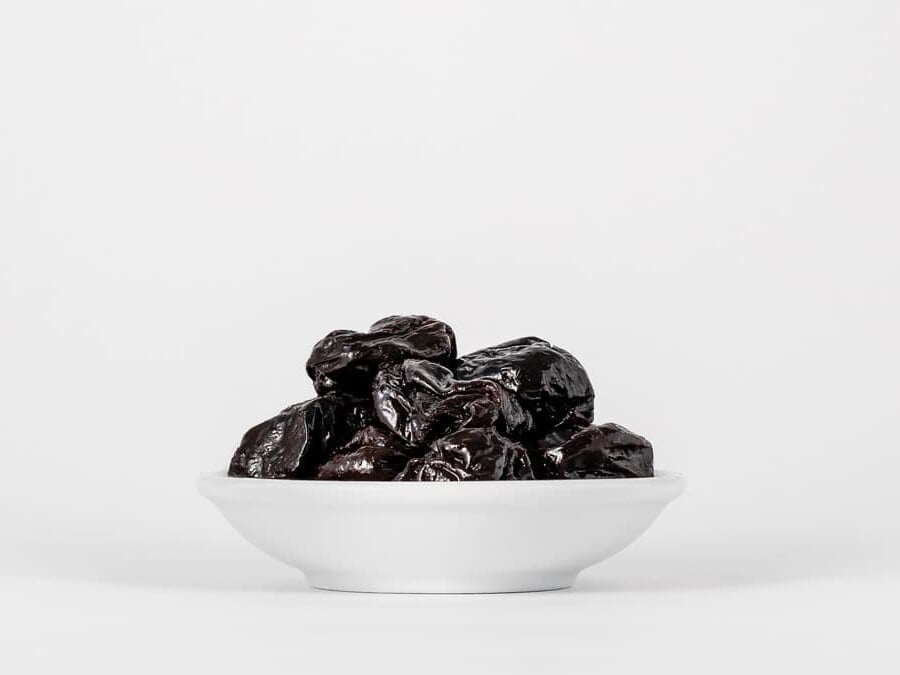 prunes in a white bowl